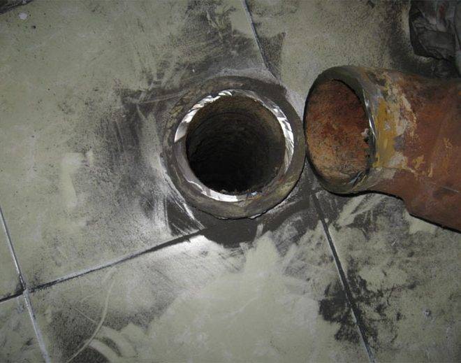 Remplacement d'un égout en fonte par un égout en plastique