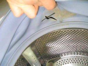 Brassard de machine à laver: objectif, instructions de remplacement et de réparation