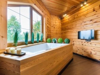 Caractéristiques de l'aménagement d'une salle de bain dans une maison en bois