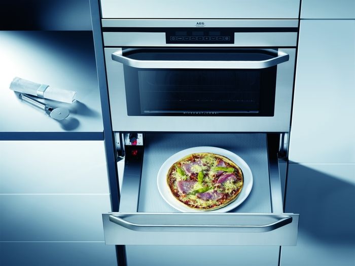 Hauteur d'installation de la hotte au-dessus de la cuisinière à gaz et électrique : normes généralement acceptées