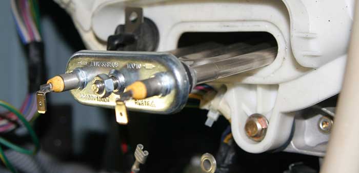 Élément chauffant pour lave-linge: comment en choisir un nouveau et le remplacer soi-même