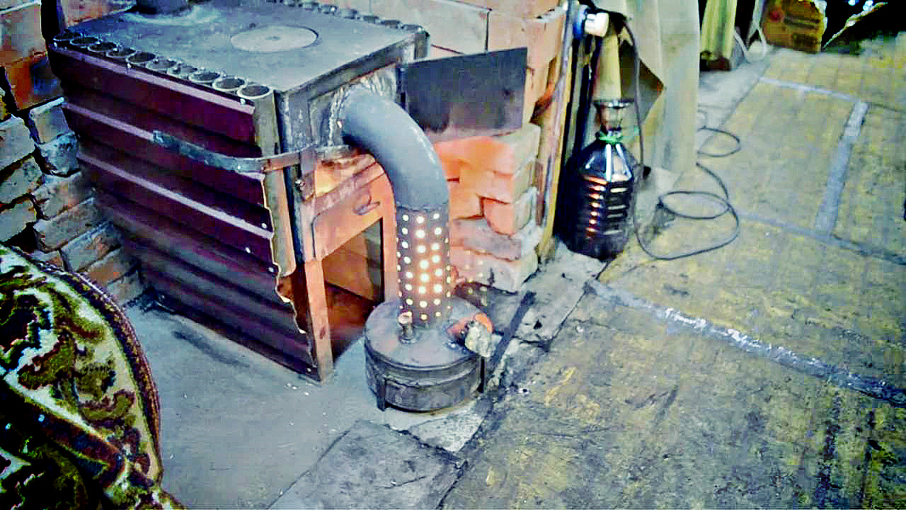 Four à faire soi-même pour s'entraîner pour un garage: comment fabriquer un poêle fait maison dans un garage