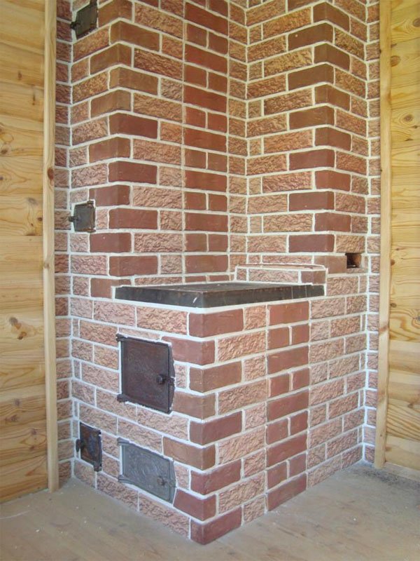 Face au four avec des carreaux de vos propres mains: comment poser correctement la céramique ou un autre type, options de finition dans la maison et le bain, photo et vidéo