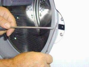 Brassard de machine à laver: objectif, instructions de remplacement et de réparation