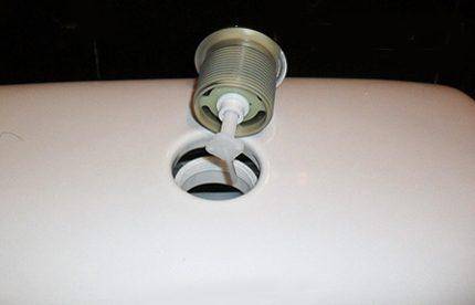 Dispositif de vidange du réservoir : mécanismes et réglage