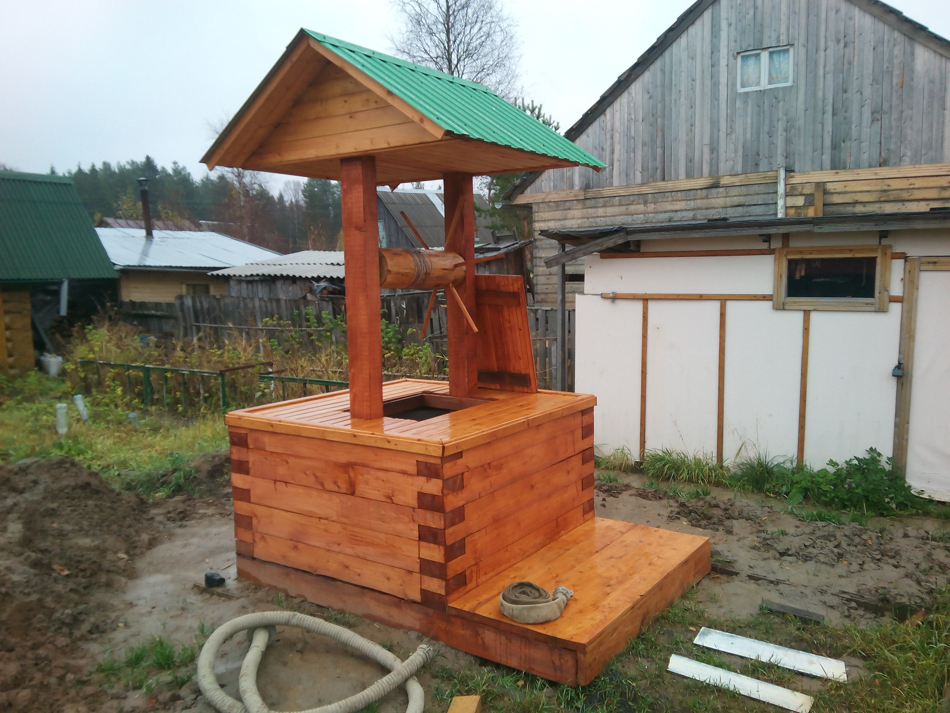 Maison pour un puits: options de construction