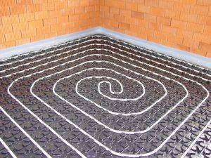 Chauffage mixte : construction d'un système "radiateurs plus plancher chauffant"