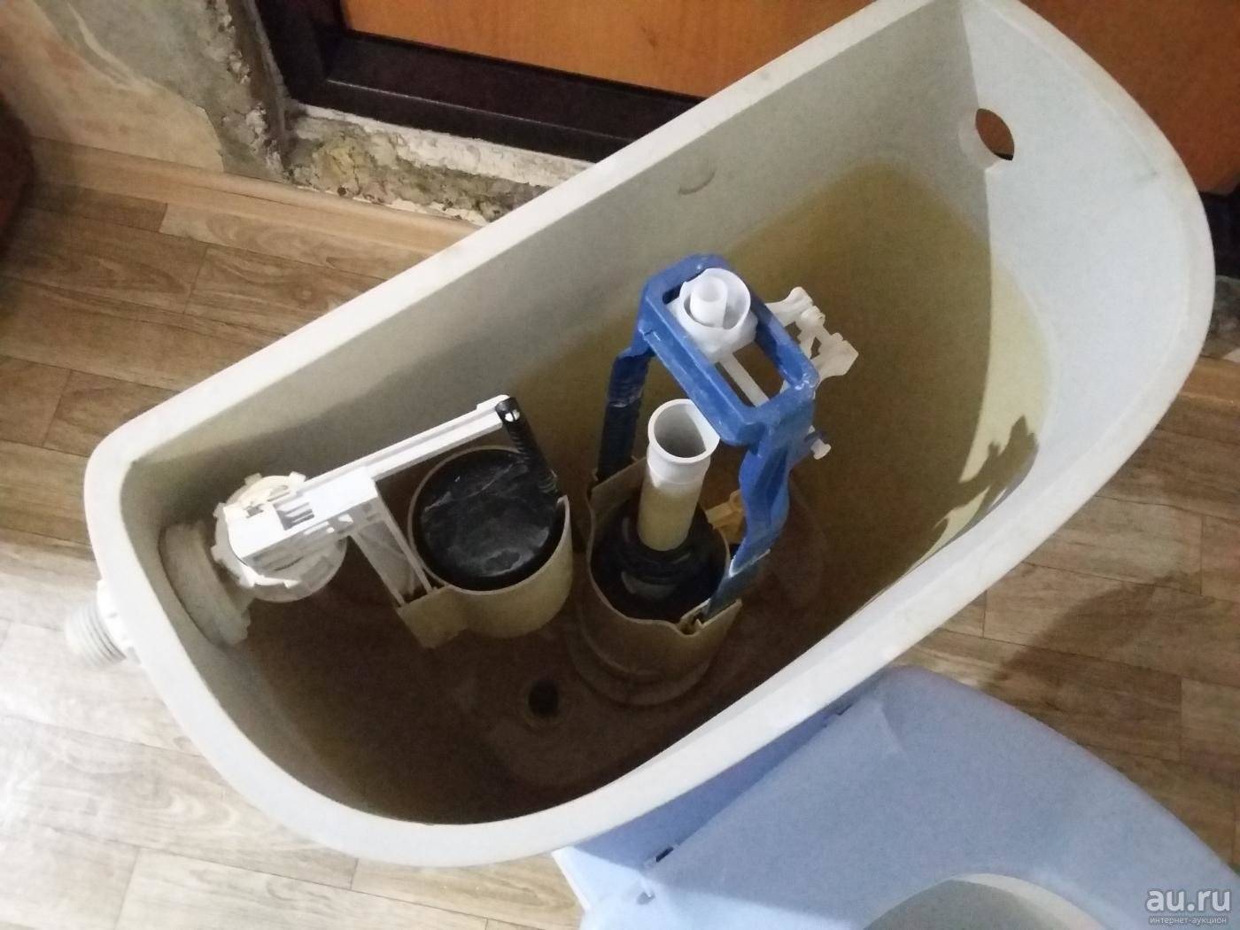 Réparation d'un réservoir de toilette avec un bouton: réparation à faire soi-même d'un mécanisme de chasse d'eau